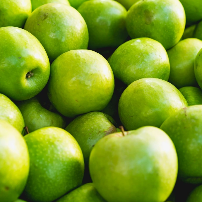 green apple fruit on brown wooden table